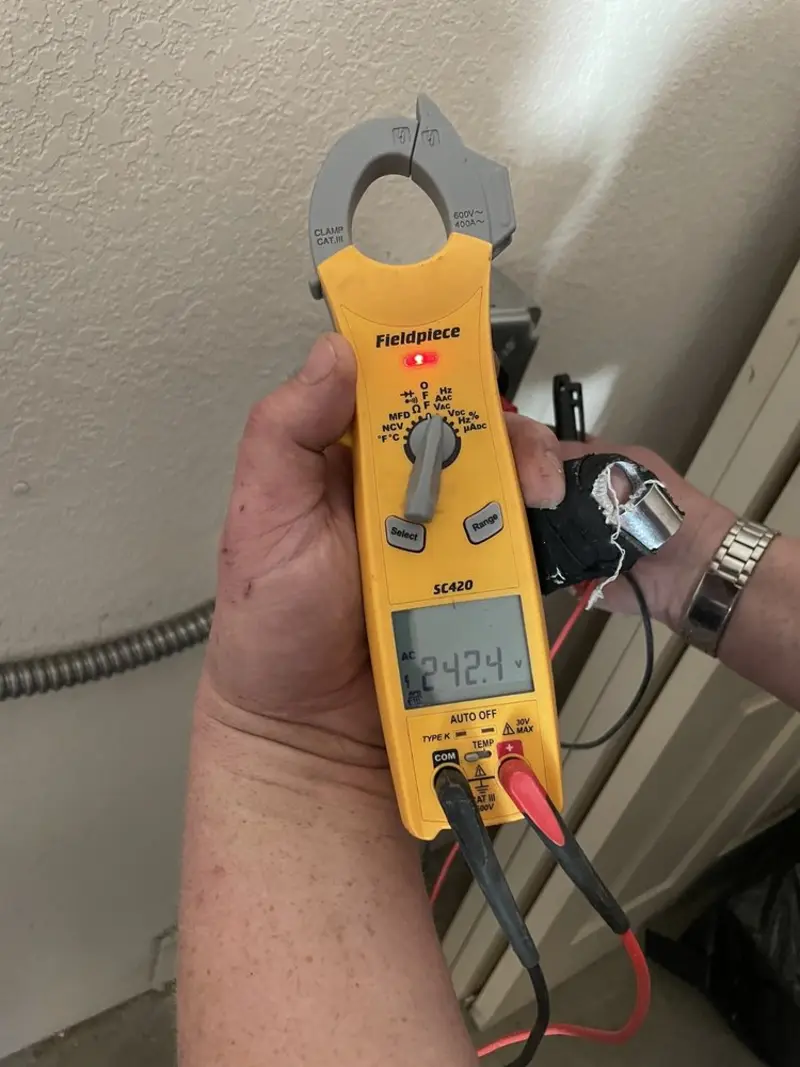 Voltage testing with clamp meter during Outlet Installation in Freeport